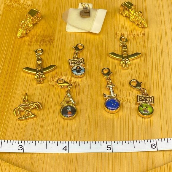 Set of 9 gold plated charms and one 1/5g 10k gold charm with a total wt of 24g - Picture 2 of 16